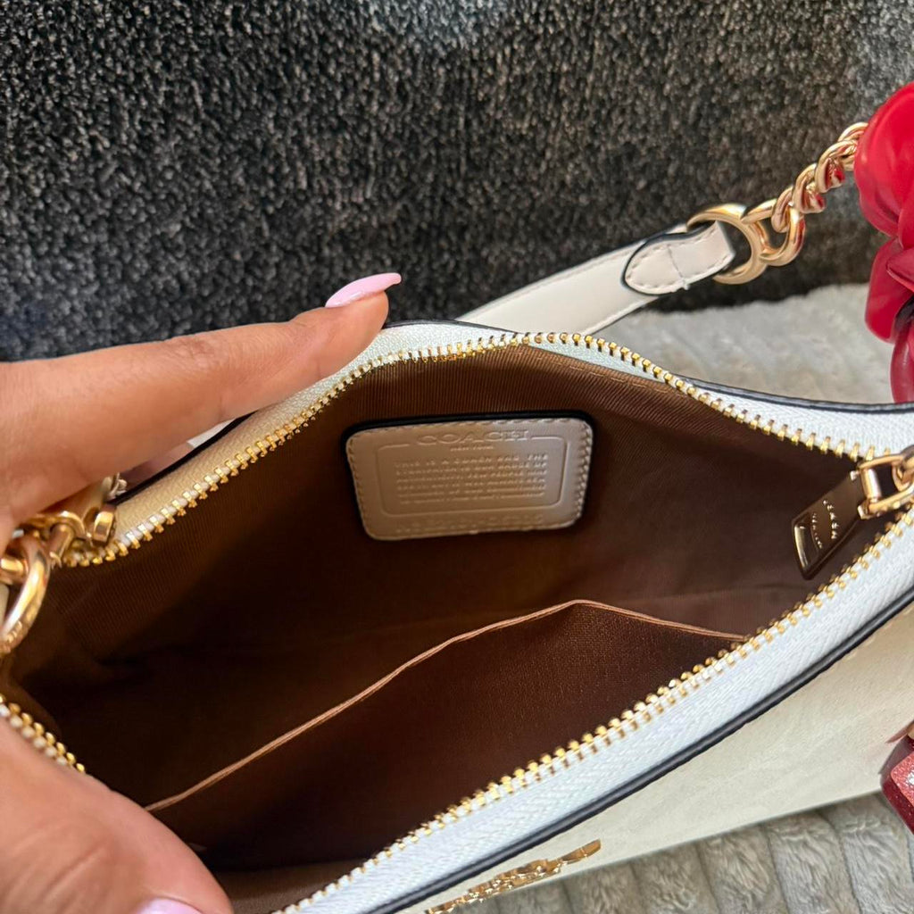 Teri white coach shoulder bag with gold hardware