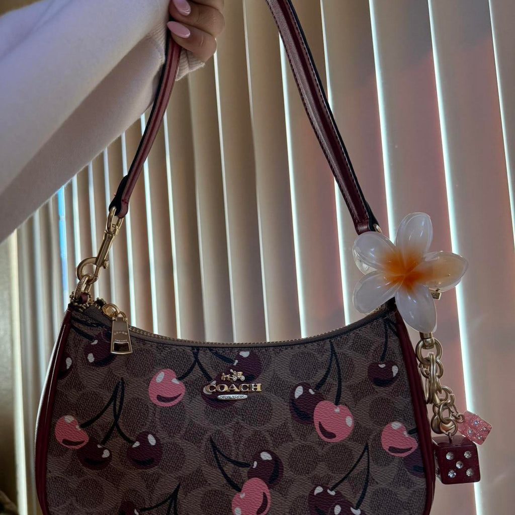 Teri shoulder bag in signature canvas with cherry print