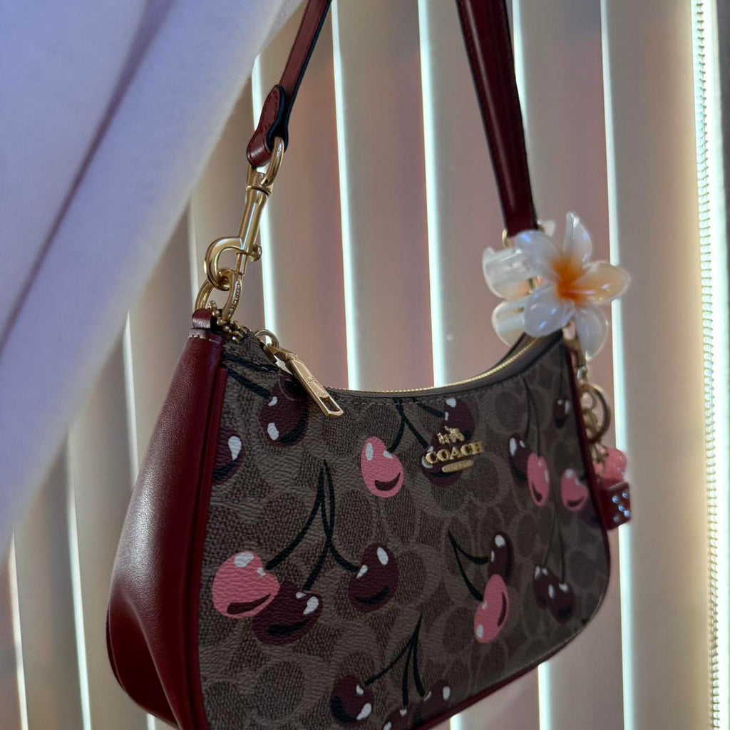 Teri shoulder bag in signature canvas with cherry print